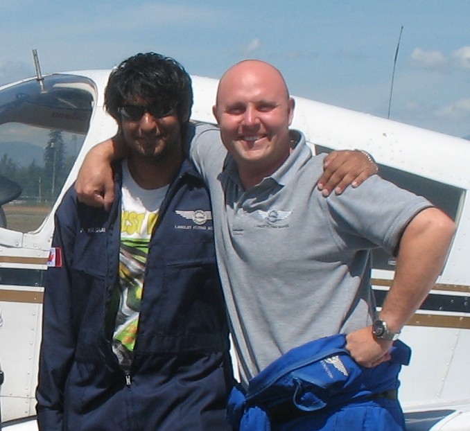 Andy Kalirai with Flight Instructor Rod Giesbrecht after the successful completion of Andy's Private Pilot Flight Test on July 28, 2008.  Langley Flying School.